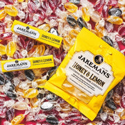 Jakemans Honey & Lemon Menthol Lozenges bag packaging honey lemon flavour 12 x 73g serving suggestion image