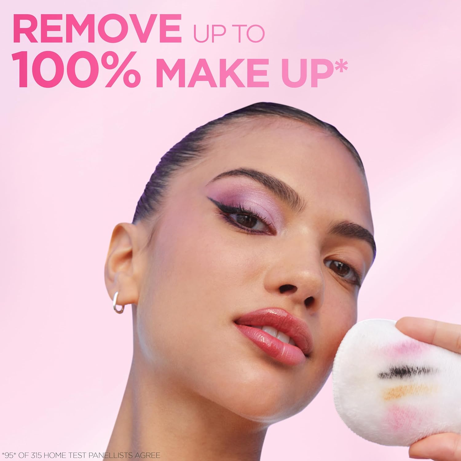 Woman using a cotton pad with Garnier Micellar Water to remove eye makeup on