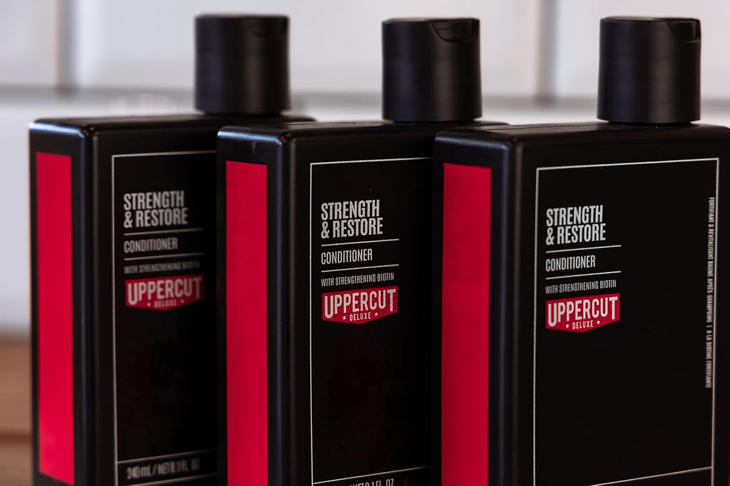 Lifestyle/use image: Uppercut Deluxe Strength and Restore Conditioner 3 240ml men hair care routine
