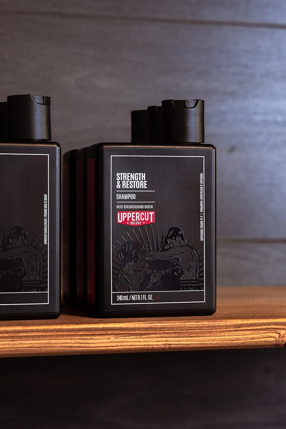 Lifestyle/use image: Uppercut Deluxe Strength and Restore Shampoo 240ml men hair care routine