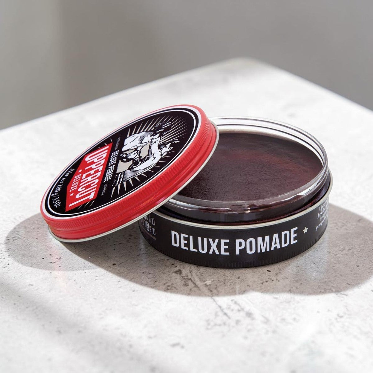 Uppercut Deluxe Pomade 300g jar strong hold high shine styling product packaging