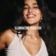 Lifestyle/use image: Sol de Janeiro Glowmotions body oil glowing skin routine rose gold bottle Cheirosa 62 fragrance 75ml